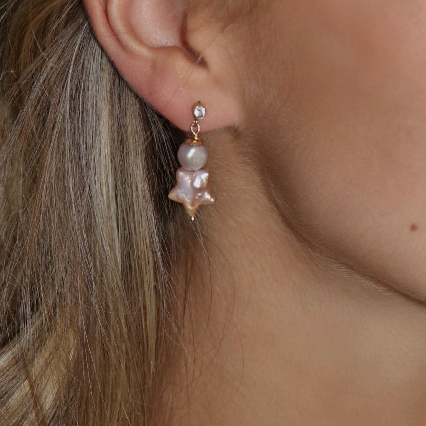 stud earrings, light pink star shaped pearl and round pearl drop earring on topaz stud