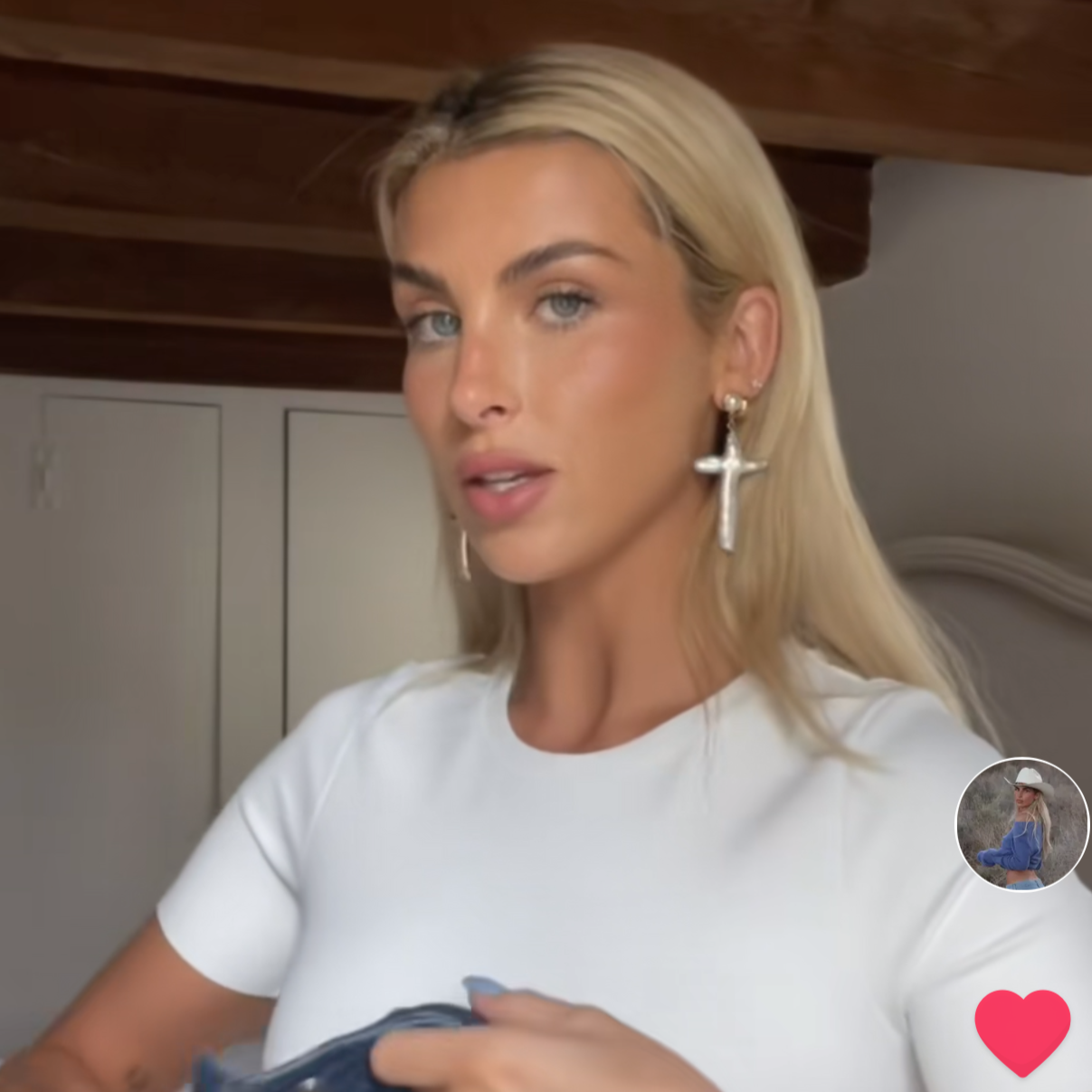 paige lorenze wearing gold pearl cross studs